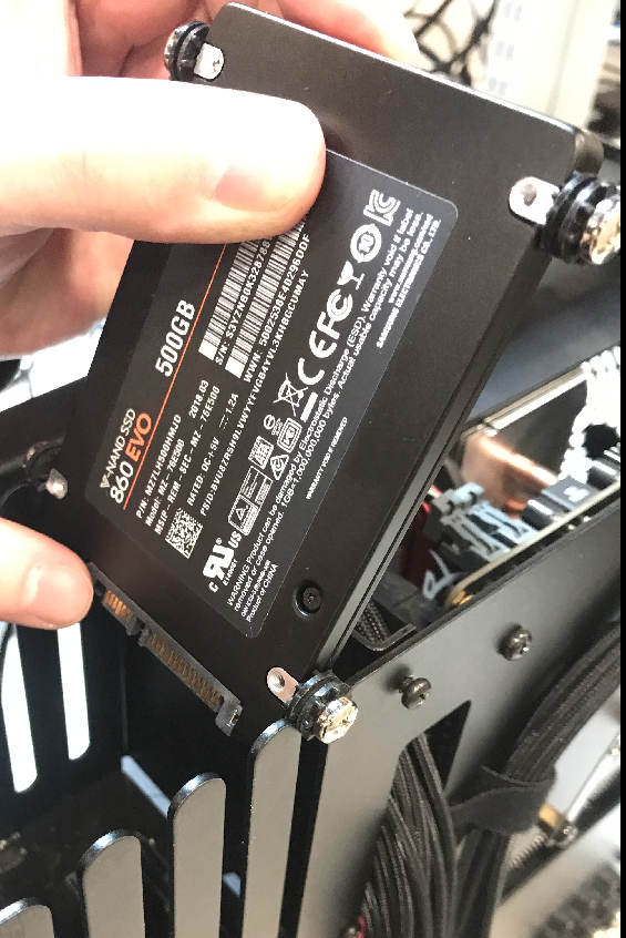 Aligning the drive screws and grommets with drive cage slots